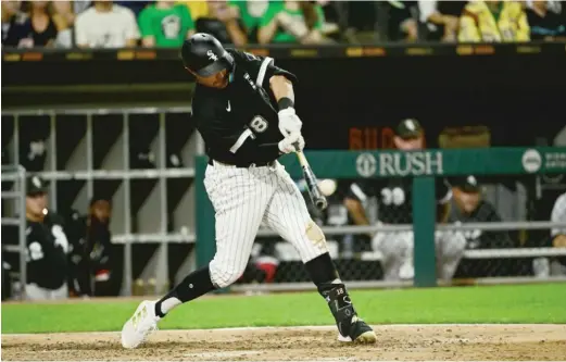  ?? GETTY IMAGES ?? AJ Pollock hits a solo homer in the eighth inning Saturday night against the Tigers. Pollock also scored the Sox’ first run on a sacrifice fly by Jose Abreu.