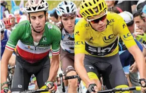  ?? AFP ?? Behind you: Froome toils in yellow as Aru (left) is set to pounce