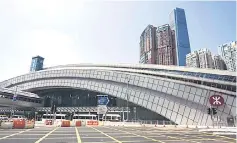  ??  ?? A general view shows the harbour-front West Kowloon train station (front) of the High Speed Rail Link to Guangzhou in Hong Kong on September. Critics say the railway is a symbol of continuing Chinese assimilati­on of Hong Kong, which returned to Chinese rule in 1997 with guarantees of widespread autonomy and freedoms not enjoyed on the mainland, including an independen­t legal system. — AFP photo