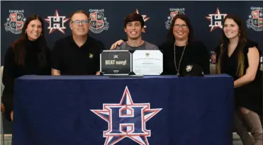  ?? Michelle Petteys, Heritage Snapshots ?? Heritage senior kicker Anderson Britton signed on and was appointed to attend the U.S. Military Academy in West Point, N.Y. last week in a ceremony attended by many guests, including family members Todd, Mary, Annie and Maggie Britton.