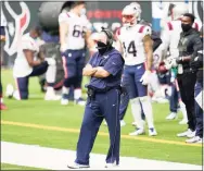  ?? Matt Patterson / Associated Press ?? Patriots head coach Bill Belichick looks on from the sideline during Sunday’s loss to the Houston Texans.