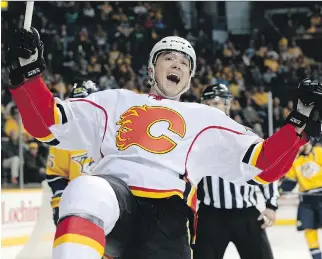  ?? MA R K H U MP H R E Y/ A S S O C I AT E D P R E S S ?? Forward Michael Ferland celebrates after scoring a goal against the Nashville Predators during a Flames’ victory in Nashville on Sunday. Calgary is in third place in the Pacific Division.