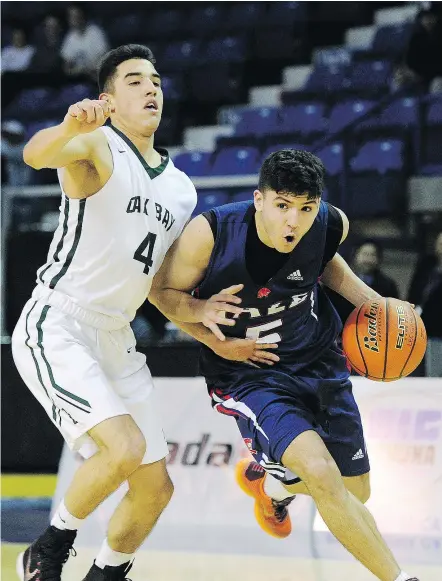  ?? MARK VAN MANEN/PNG FILES ?? Oak Bay’s Jaden Touchie, left, averages 18 points per game but his coach likes that he’s an outstandin­g defensive player. ‘He just won’t give up easy shots,’ says coach Chris Franklin.