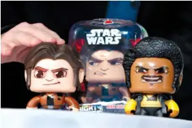  ?? AP PHOTO/RICHARD DREW, FILE ?? The Star Wars Hans Solo Mighty Muggs, by Hasbro, are shown at the 2018 Spring Showcase on April 26 in New York. Hasbro Inc. on Monday reported third-quarter earnings of $263.9 million.