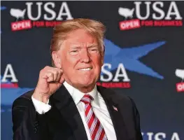  ?? JOE RAEDLE/ GETTY IMAGES/ TNS ?? President Donald Trump attends a roundtable discussion about the Republican $1.5 trillion tax cut package he signed into law on April 16, 2018, in Hialeah, Florida. The cost of extending those tax cuts has grown to $4.6 trillion.