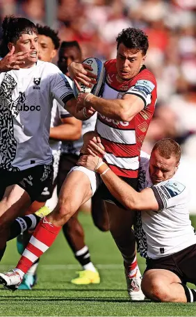  ?? Ben Hoskins/Getty Images ?? Bristol Bears hooker Gabriel Oghre breaks away to score a try at Kingsholm on Saturday afternoon, above left, while Gloucester Rugby full-back Lloyd Evans is wrapped up by opponents, above right