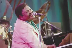  ??  ?? US PIANIST and singer-songwriter Fats Domino performs on the piano during a concert at the 27th Jazz Festival in Montreux, Switzerlan­d on July 14, 1993.