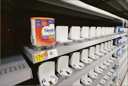  ?? Associated Press ?? Shelves typically stocked with baby formula sit mostly empty at a store in San Antonio last month. Parents across the U.S. are scrambling to find baby formula because supply disruption­s and a massive safety recall have swept many leading brands off store shelves.