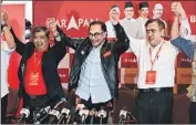  ?? Mohd Rasfan AFP/Getty Images ?? THE ALLIANCE headed by Anwar Ibrahim, center, won the most seats, but was still far from a majority.