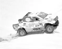  ??  ?? Toyota’s driver Nasser Al-Attiyah of Qatar and co-driver Mathieu Baumel of France compete during the Stage 6 of the Dakar Rally between Arequipa and San Juan de Marcona, Peru, on January 13, 2019. - AFP photo