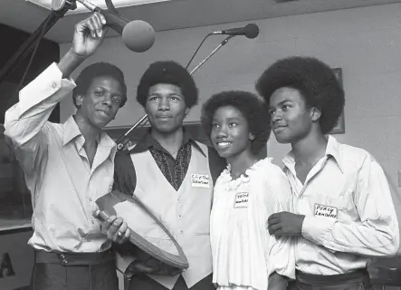  ?? FRED J. GRIFFITH/THE COMMERCIAL APPEAL ?? May 19, 1979: Essie Moore, left, Clifton Johnson, Valerie Woodard and Percy Lambert of Rosa Fort High School’s Quiz ‘Em on the Air Champions at WDIA Radio. The team from Tunica, Miss., defeated Raleigh-egypt High School after the two teams had battled evenly for two rounds. The final score was Rosa Fort 1,525 to Raleigh-egypt’s 1,325.