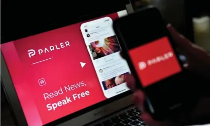  ?? Photograph: Olivier Douliery/AFP/Getty Images ?? Parler was banned from Apple’s App Store and the Google Play store in January.