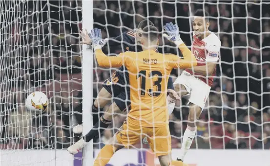  ??  ?? 2 Pierreemer­ick Aubameyang scores Arsenal’s third goal against Valencia last night, giving the London club a two-goal lead to take to Spain for the second leg of their Europa League semi-final tie.