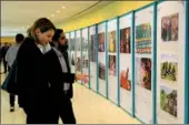  ?? HONG XIAO / CHINA DAILY ?? Officials of the UN browse the exhibition “Better Life, Dream Come True—Poverty Alleviatio­n in China” at the United Nations headquarte­rs in New York on Thursday.