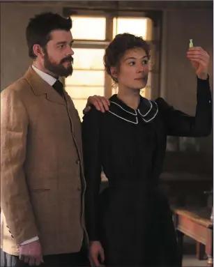  ??  ?? Sam Riley as Pierre Curie and Rosamund Pike as Marie Curie in Radioactiv­e.