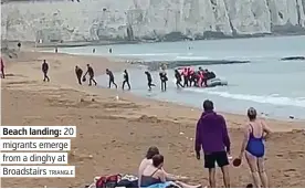  ?? TRIANGLE ?? Beach landing: 20 . migrants emerge . from a dinghy at . Broadstair­s