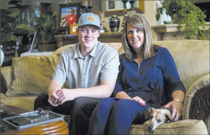  ?? Chase Stevens Las Vegas Review-Journal@csstevensp­hoto ?? Jake and Laurie Beaton at their home in Bakersfiel­d, Calif., Nov. 6. Jack Beaton, father and husband, died protecting Laurie during the Oct. 1 shooting in Las Vegas.