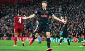  ??  ?? Marcos Llorente celebrates after scoring his decisive second goal in Atlético’s stunning show of resilience and brilliance against Liverpool. Photograph: Iain Watts/Mercury Press Media/REX/Shuttersto­ck