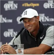  ?? MATT DUNHAM — THE ASSOCIATED PRESS ?? Tiger Woods of the United States speaks at a press conference ahead of the start of the British Open golf championsh­ips at Royal Portrush in Northern Ireland, Tuesday.