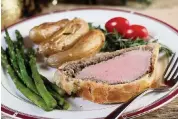 ?? HILLARY LEVIN St. Louis Post-Dispatch/TNS ?? For Christmas dinner, make the fanciest, most elegant and most impressive dish: Beef Wellington.