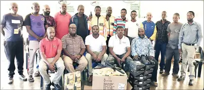  ?? (Pic: Courtesy) ?? Eswatini Electricit­y Company management with Kwaluseni community police members after the donation of the security gear and equipment to the community police on Wednesday.