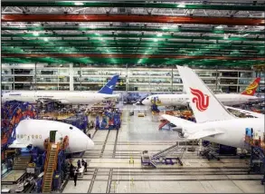  ?? Bloomberg News/TRAVIS DOVE ?? Boeing Co. Dreamliner 787 planes sit on the production line at the company’s final-assembly plant in North Charleston, S.C., in December.