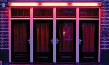  ??  ?? Windows in the red light district of Amsterdam. Photograph: Dean Mouhtaropo­ulos/Getty Images