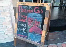  ?? MARCO SANTANA/STAFF ?? A sign outside of The Brass Tap in Orlando entices customers during a “Pokemon Go” Pub Crawl on Thursday. The mobile game has more than 30 million users.