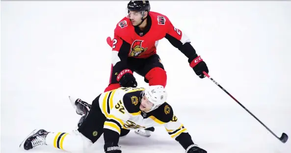  ?? SEAN KILPATRICK/THE CANADIAN PRESS ?? Senators defenceman Dylan DeMelo, seen pushing Boston Bruins centre Sean Kuraly on Tuesday, will be in for another stern test Friday in Colorado.