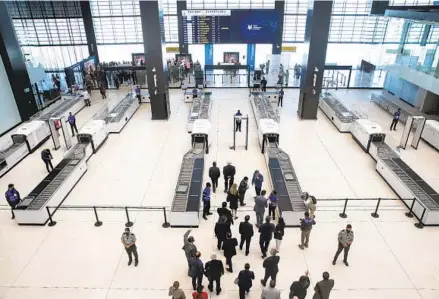  ?? ANA RAMIREZ U-T ?? Binational leaders tour the Tijuana Internatio­nal Airport expansion Monday. The building serves Cross Border Express travelers.