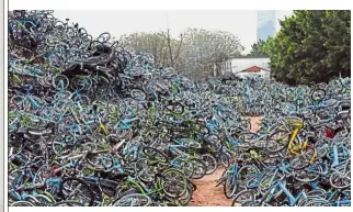  ??  ?? Wheels of misfortune: A bicycle cemetery in Guangdong province, China.
