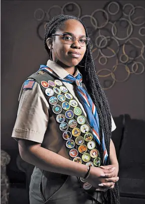  ??  ?? Lake Central High School senior Kendall Jackson is one of only 21 Black females in the nation to become an Eagle Scout. TOP: Displayed are some of the 39 merit badges Jackson has earned.