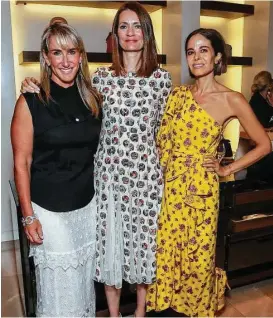  ?? Bob Levey photos / Getty Images ?? Courtney Sarofim, from left, Plum Sykes and Alison Sarofim take in the “Party Girls Die in Pearls” book launch at Burberry Houston.