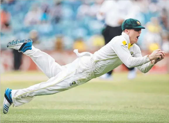  ?? Picture: PHIL HILLYARD ?? Chris Rogers dives for a spectacula­r catch to dismiss Tim Bresnan during the final day of the third Ashes Test at the WACA in Perth on Tuesday