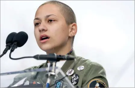  ?? ANDREW HARNIK — THE ASSOCIATED PRESS ?? Emma Gonzalez, a survivor of the mass shooting at Marjory Stoneman Douglas High School in Parkland, Fla., closes her eyes and cries as she stands silently at the podium for the amount of time it took the Parkland shooter to go on his killing spree...