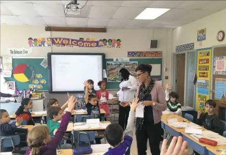  ?? Ashley Zahorchak ?? Point Park University elementary education majors at Clara Barton Elementary School in West Mifflin. Citing renewed degree demand, Point Park in September announced it is converting its teaching programs into a new School of Education.