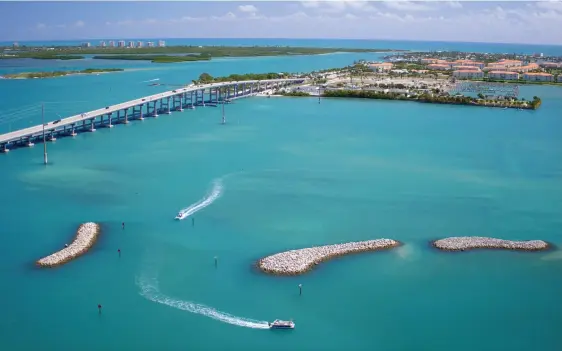  ??  ?? ABOVE: Aerial view of Fort Pierce. OPPOSITE: Tanger Outlets in Daytona Beach.