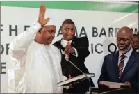  ?? PICTURE: AP ?? Adama Barrow, left, when he was sworn in as president of Gambia at Gambia’s embassy in Dakar, Senegal.