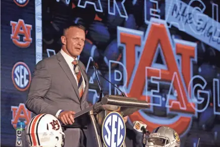  ?? BUTCH DILL/AP ?? Auburn head coach Bryan Harsin speaks to reporters during SEC media days Thursday in Hoover, Ala. Harsin tested positive for COVID-19 on Thursday.
