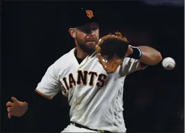  ?? NHAT V. MEYER — BAY AREA NEWS GROUP, FILE ?? The Giants’ Evan Longoria fields a ball hit by the Diamondbac­ks’ Tim Locastro in the seventh inning at Oracle Park in San Francisco on Aug. 26.