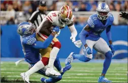  ?? TNS ?? Detroit Lions cornerback Jeff Okudah (23) tackles San Francisco 49ers wide receiver Deebo Samuel (19) during the first half at Ford Field in Detroit on Sunday.