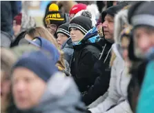  ??  ?? Outdoor hockey is cold hockey, as spectators discovered Saturday.