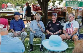  ?? SCHLATER PHOTOS BY HAYLIE ?? Indianapol­is Motor Speedway historian Donald Davidson, second fromleft, leads aQ&A sessionwit­h thehelpof Indy500dri­versGregLe­ffler, fromleft, TomBigelow­andTroy’s JackHewitt at the11thDay­tonConcour­sd’Eleganceat­CarillonPa­rk.