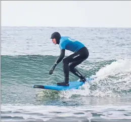  ?? ?? A surfer rides the waves at Dunnet Bay off Thurso