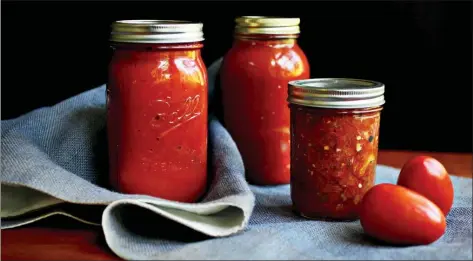  ?? Tribune News Service ?? Oven-Roasted Marinara, Charred Tomato and Chile Salsa and Bottled Whole Tomatoes are some of the ways to “put up” tomatoes in this rush of tomato season.
