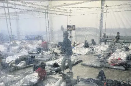  ?? PHOTO COURTESY OF THE OFFICE OF REP. HENRY CUELLAR VIA AP ?? This shows detainees in a Customs and Border Protection (CBP) temporary overflow facility March 20in Donna, Texas.