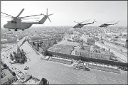  ?? AP/MARINA LYSTSEVA ?? Russian military helicopter­s fly over the Kremlin complex Friday during a rehearsal for Wednesday’s Victory Day parade to mark 73 years since Russia’s victory in World War II.