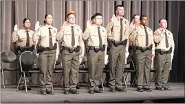  ?? PHOTOS BY MELANIE NGUYEN / THE CALIFORNIA­N ?? The new academy graduates are sworn in as they receive their certificat­es to qualify as detentions deputies Friday at the Bakersfiel­d College Indoor Performing Arts Center.