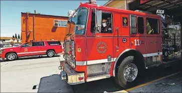  ?? Luis Sinco Los Angeles Times ?? A COVID-19 OUTBREAK at Long Beach Fire Station 11 led to changes in how calls related to the coronaviru­s are handled, including a specialize­d team to respond to them. The station now has decontamin­ation areas.