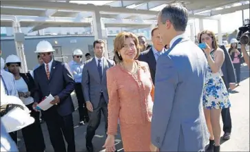  ?? Kent Nishimura Los Angeles Times ?? MARIA CONTRERAS-SWEET said her investor group would consider buying Weinstein Co. assets that may become available in the event of bankruptcy proceeding­s. Above, she greets Mayor Eric Garcetti in 2015.